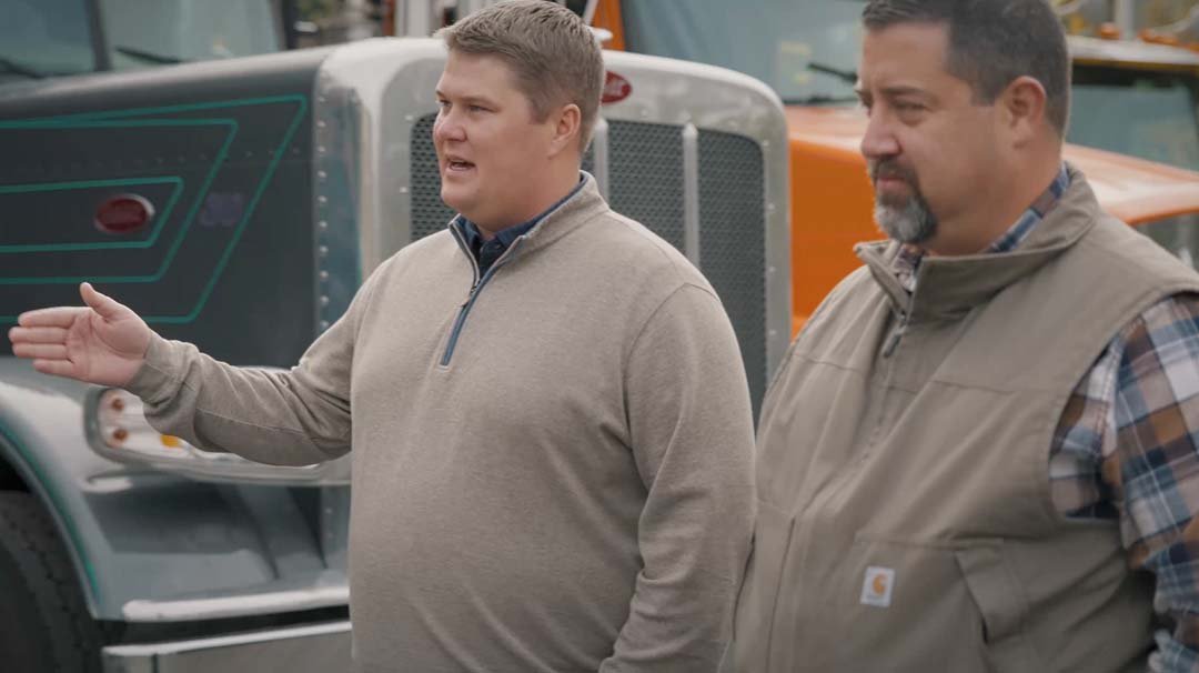 Logan Haugen reviewing operations on-site with a Team Haugen client